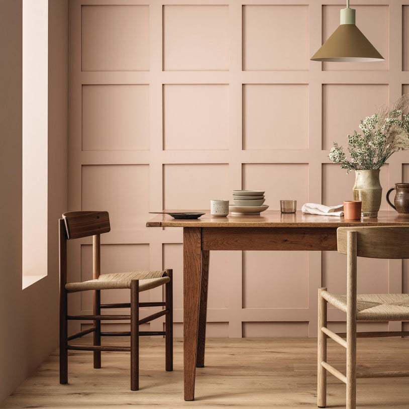 A finished room with tiles and wall paint in matching warm tones
