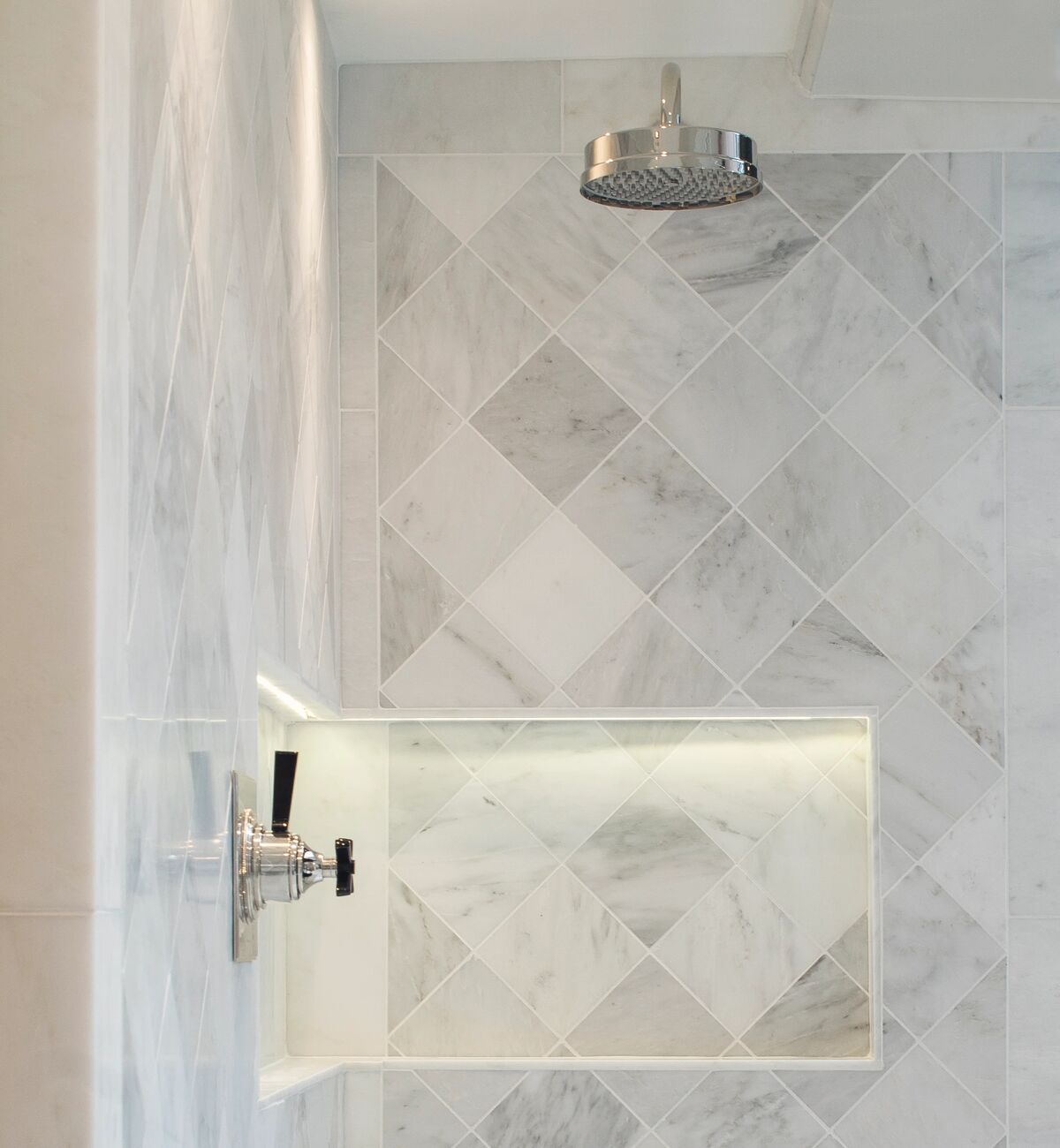 Large format tile running from floor to wall