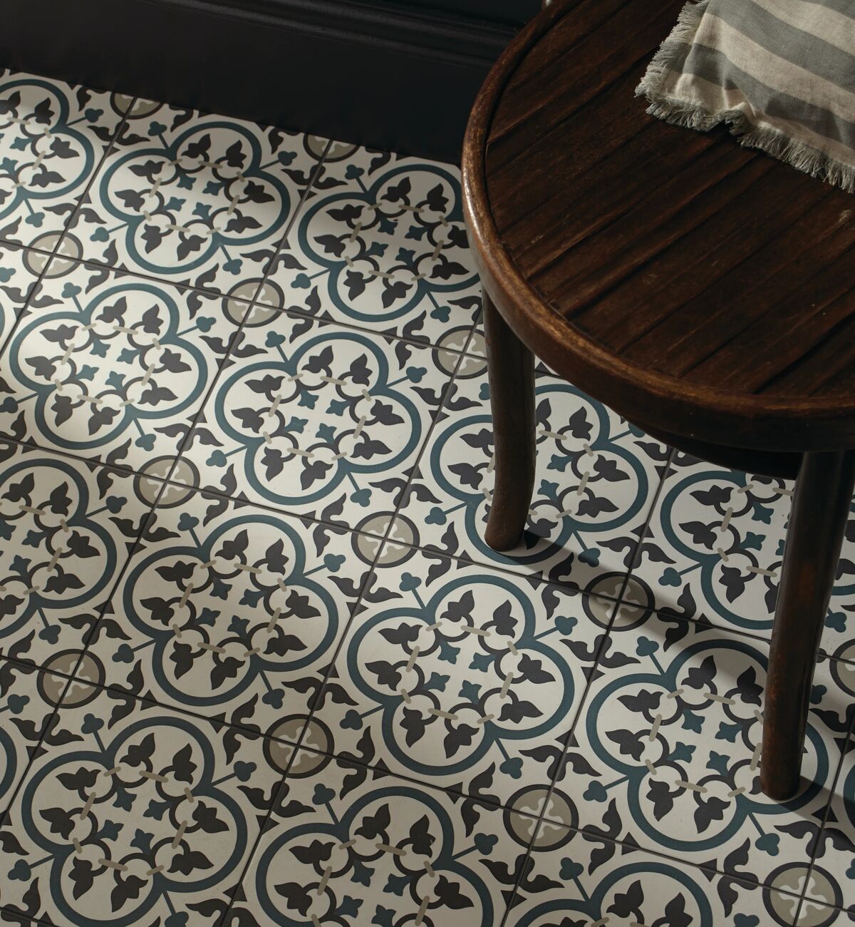 Patterned heritage tiles in a hallway