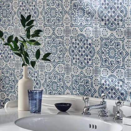 Nina Campbell Seville Blue wall tile with sink in the bathroom