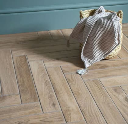 Wood effect floor tile with basket on the floor